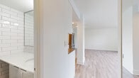 Located in the heart of Vancouver's West End at 1255 Pendrell St, this efficiently designed studio suite offers a bright and functional single-floor layout. The open-concept living area is finished with light-toned laminate hardwood flooring that runs throughout, contributing to a clean, modern aesthetic. Crisp white walls and a neutral palette keep the space feeling fresh and airy.

A standout feature of the living area is the expansive floor-to-ceiling window spanning the full width of one wall, flooding the interior with natural light and framing impressive views of the surrounding Vancouver skyline and lush greenery. A baseboard heating system runs along the window wall, ensuring year-round comfort.

The kitchen is neatly tucked into an alcove and features white cabinetry, a dark tile backsplash, a stainless steel dishwasher, and a full-size stainless steel refrigerator, providing all the essentials within a compact and well-organized footprint.

The bathroom is tastefully finished with classic white subway tile extending from floor to ceiling, a tiled floor, a white vanity with a stone-topped countertop, and a glass-enclosed shower, creating a clean and timeless look. Overall, this suite offers a well-appointed and practical living space in one of Vancouver's most vibrant and walkable neighborhoods.
