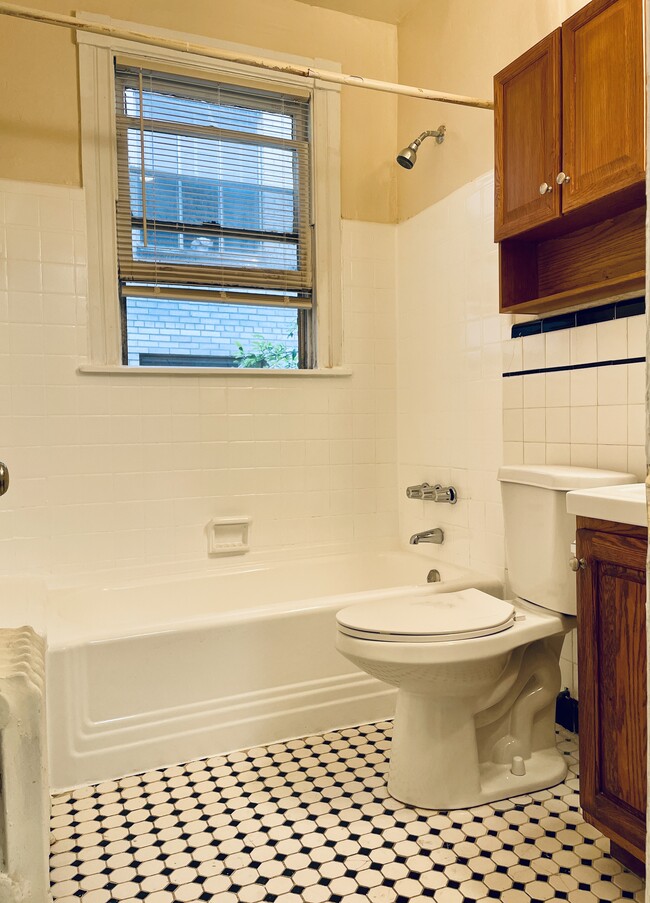 White tiled tub and floor - 2716 Wisconsin Ave NW