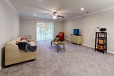 Located at 835 Broadway Ave in Holbrook, NY, this single-floor home offers a thoughtfully designed layout with quality finishes throughout. The kitchen is a standout feature, showcasing rich cherry wood cabinetry, dark granite countertops, a striking dark tile backsplash, and gleaming black tile flooring. Stainless steel appliances — including a side-by-side refrigerator with ice and water dispenser, a range with microwave above, and a dishwasher — complete the space, which also benefits from natural light through large windows with white blinds. The living room is generously proportioned, featuring plush carpeting, recessed lighting, a ceiling fan, crown molding, and sliding glass doors that open to an outdoor view. Additional rooms include multiple bedrooms, each dressed with soft carpeting, ceiling fans, recessed lighting, crown molding, and windows that bring in natural light. The bedrooms offer a calm and comfortable atmosphere ideal for rest. Two bathrooms serve the home, both featuring cherry wood vanities with dark granite countertops. One includes a tiled tub-shower combination with sliding glass doors, while the other offers a walk-in glass-enclosed shower. Tile flooring completes each bathroom's clean, polished look.