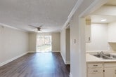 Located at 2501 Whitney Lawn Dr in Metairie, Louisiana, this single-floor, three-bedroom, two-bathroom home offers a well-organized and functional layout across its thoughtfully designed rooms. The living room serves as the heart of the home, featuring rich wood-style flooring, crown molding, a ceiling fan, and a sliding glass door that opens to an outdoor patio, flooding the space with natural light and providing pleasant exterior views. Adjacent to the living area, the galley-style kitchen is efficiently laid out with white cabinetry, ample counter space, a double-basin sink, and full appliances including a refrigerator and range. The bedrooms are comfortably sized, each featuring wood-style flooring, ceiling fans, crown molding, and windows that bring in natural light. The primary bedroom includes access to a closet. Both bathrooms are finished in a clean, neutral palette, featuring white vanities with single-basin sinks, oval mirrors with sconce lighting, and a tub-shower combination. Throughout the home, consistent wood-style flooring, textured ceilings, and a warm neutral color scheme create a cohesive and inviting atmosphere. Two closets provide additional storage, and a hallway connects the bedrooms and bathrooms seamlessly.