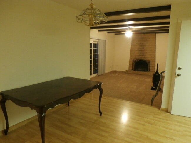 Building Photo - Adorable 4/2 With GREAT Backyard.  Gardene...