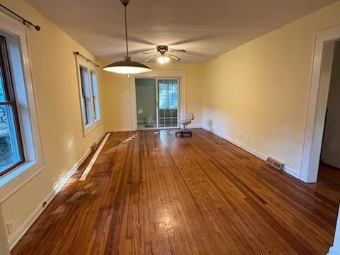 restored hardwood floor, LR, DR w 4 season porch - 921 Clarence Ct