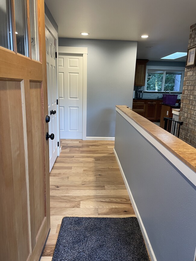 Entry into the home with an open concept kitchen, living and dining. - 2186 Evergreen Ave SE