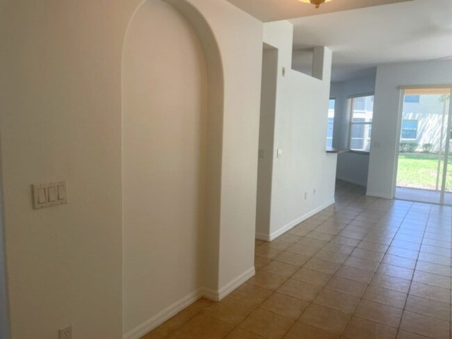 Building Photo - Elegant 3 Bedroom End-Unit Condo with Screened Lanai & Pond Views and A Private Garage