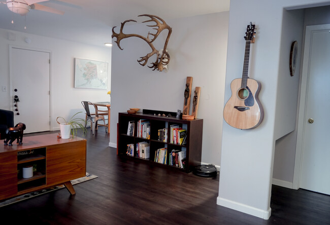 Living area opens to dining area on the left and bedrooms/bathrooms to the right - 1508 Kinnikinnick St