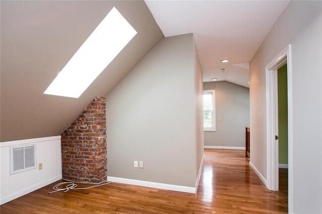 Upstairs hallway and living space with skylight - 259 Doyle Avenue