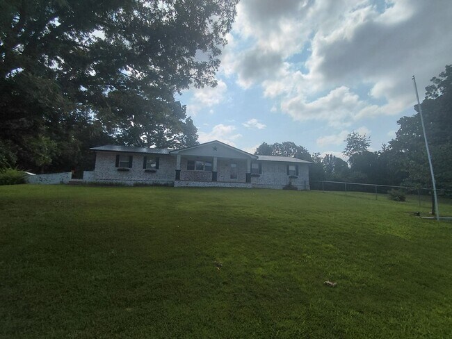 Building Photo - Fenced home close to post!