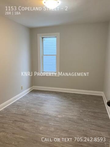 Photo du bâtiment - Two Bedroom Plus Den