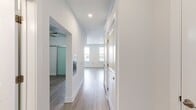 Located at 580 S Goddard Blvd, Apt 3137, in King of Prussia, PA, this 480-square-foot studio apartment offers a thoughtfully designed single-floor layout that maximizes every inch of available space. The open-concept living area features light-toned luxury vinyl plank flooring throughout, crisp white walls, and recessed lighting, creating a bright and airy ambiance. Two generously sized windows allow natural light to fill the main living space, offering views of the surrounding greenery. A ceiling fan adds both functionality and comfort to the bedroom alcove, which is accessible through a framed opening off the main living area.

The kitchen is well-appointed with white shaker-style cabinetry, light granite countertops, a classic white subway tile backsplash, and a full suite of stainless steel appliances, including a refrigerator with ice maker, electric range, built-in microwave, and dishwasher. Light wood-look flooring and a window over the sink contribute to a clean, modern aesthetic.

The bathroom showcases elegant marble-look tile flooring with subtle veining, white cabinetry with brass hardware, a rich granite vanity countertop, and a soaking tub with white subway tile surround and coordinating brass fixtures, delivering a polished, upscale finish.