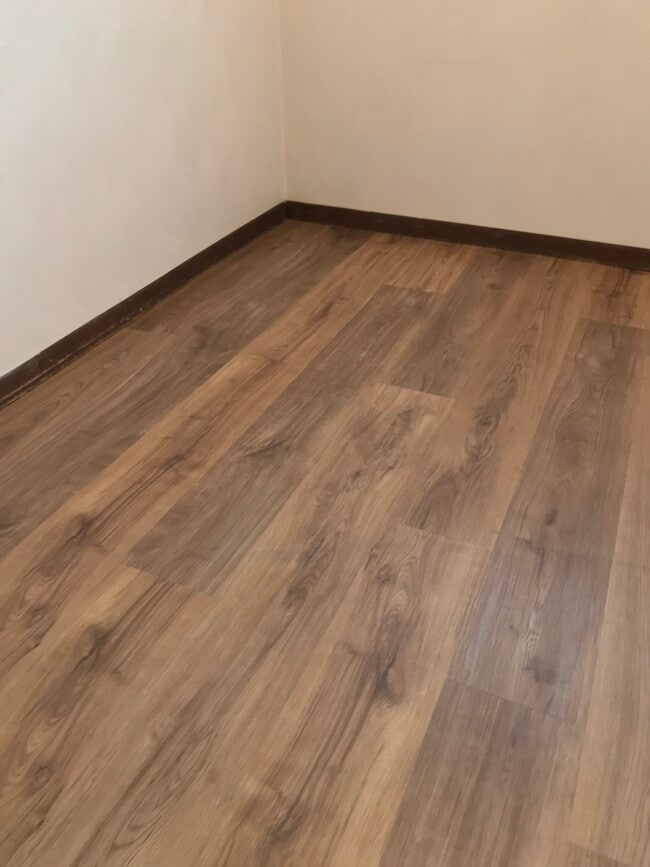 Flooring in kitchen and dining area Walcott Manor Apartments - Walcott Manor Apartments