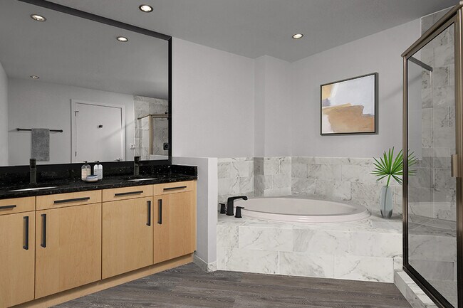 Mejoras de baño incluyen espejos enmarcados y azulejos de porcelana marble-look rodean. - Zoso Flats