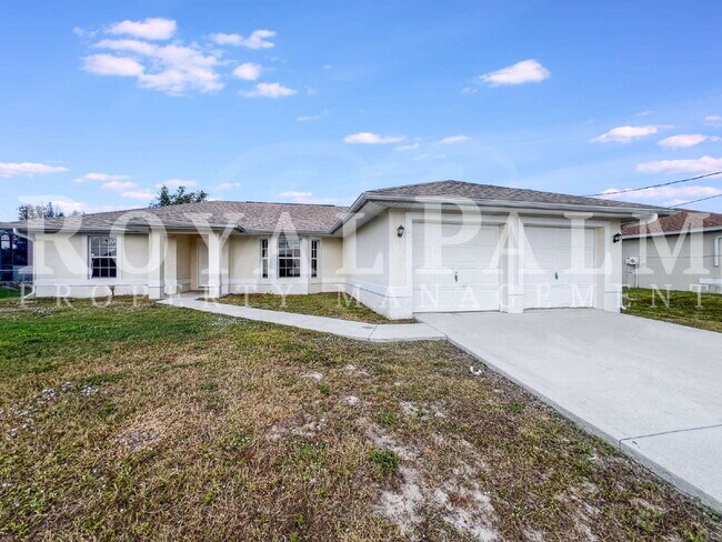 Building Photo - Bloom Into Your New Home – 3BR/2BA Lehigh Acres Rental, Get This... Garage AND Lawn Care Included!