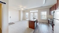 This 530 square foot apartment in Manassas, VA offers a thoughtfully designed living space. The single-floor layout features one bedroom and one bathroom, ideal for individuals or couples seeking a low-maintenance lifestyle. The heart of the home is an open-concept living area, seamlessly blending the kitchen and living room. The kitchen boasts rich wood cabinetry, granite countertops, and stainless steel appliances, creating a modern and functional cooking space. Wood-style flooring in the kitchen area transitions to plush carpeting in the living room and bedroom, adding warmth and comfort. The bathroom is well-appointed with a granite vanity top, large mirror, and a combination tub/shower. Large windows throughout provide ample natural light, enhancing the sense of space. The bedroom, measuring 150 square feet, offers a cozy retreat with a walk-in closet for added storage. This apartment combines efficiency and style, making the most of its compact footprint.