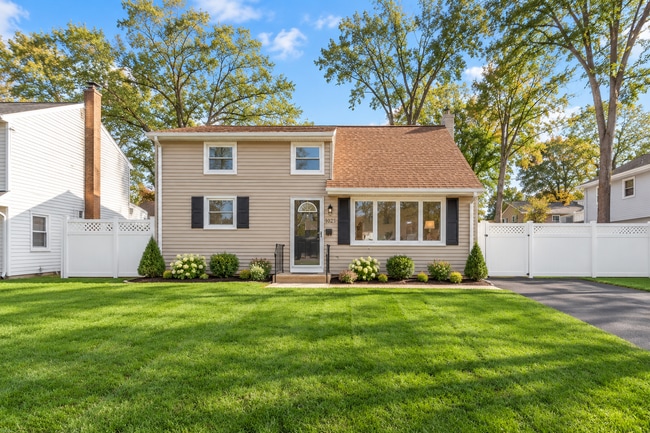 Inviting curb appeal with a well-maintained front lawn, attractive landscaping, and a welcoming entr - 237 Johnson Ave