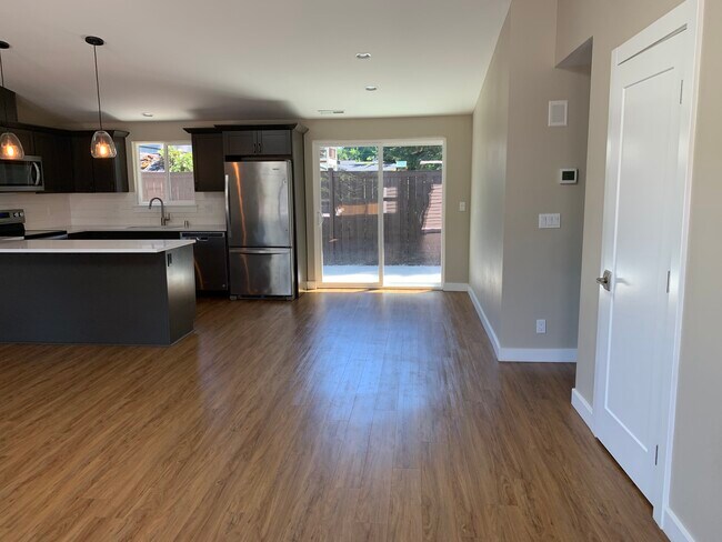 New designed kitchen in open floor plan. beautiful quartz countertops, cabinets, stainless appliance - 1714 Madison Way