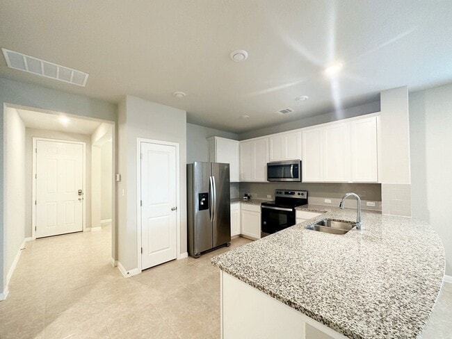 Building Photo - Bright & Roomy 5 Bedroom, 2.5 Bathroom Home with 2-Car Garage