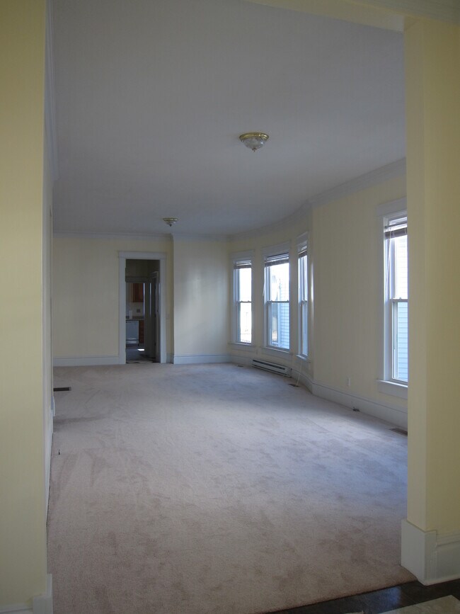 The view of the family room from as seen from the front entry. Dining area can be seen beyond. - 1435 South Center Street