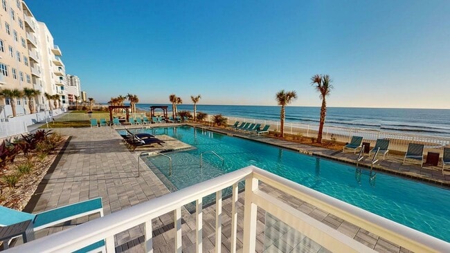 Take a dip in the pool or enjoy the ocean, both just steps from your door. - Triton Cay - Daytona Apartments
