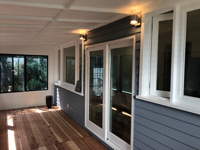 Unique sunroom surrounded by trees and vines - 4228 Lockwood Ave