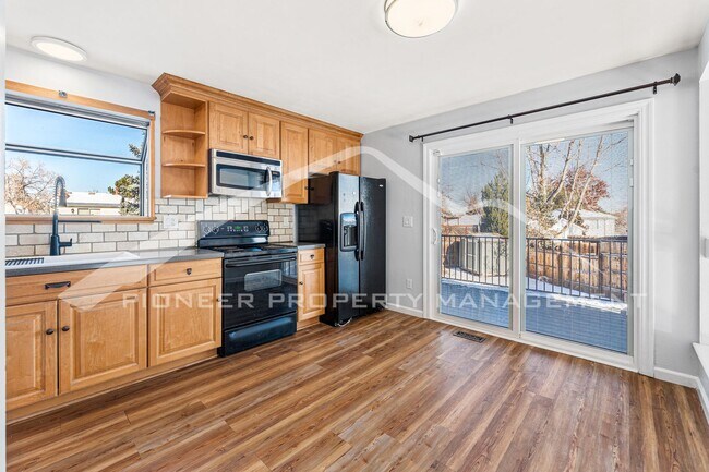 Building Photo - Beautiful Home with Fenced Back Yard and A...