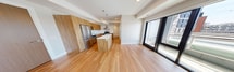 Located at 1325 Riverbend Rd in London, Ontario, this contemporary 2-bedroom, 1-bathroom condo offers 750 square feet of thoughtfully designed single-floor living. The open-concept kitchen and living area serves as the heart of the unit, featuring warm wood-grain cabinetry, white quartz countertops, a subway tile backsplash, and a full suite of stainless steel appliances including a refrigerator, electric range with hood vent, and dishwasher. A kitchen island with pendant globe lighting adds both functionality and style. Light bamboo hardwood flooring flows consistently throughout the entire unit, lending warmth and cohesion to every room. The living area is bright and spacious, with floor-to-ceiling sliding glass doors opening onto a private balcony with open urban views. Both bedrooms are well-proportioned with large windows that invite natural light; the primary bedroom measures 120 square feet and includes a dedicated closet. The bathroom features elegant marble-style tile surrounds in the tub/shower area, neutral floor tiles, and clean white finishes. A dedicated closet provides additional storage. The unit's neutral palette, modern fixtures, and abundant natural light create a clean, functional, and contemporary living environment.