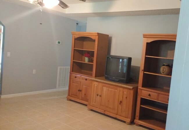 Living room with ceiling fan - 8663 Highway 83 N