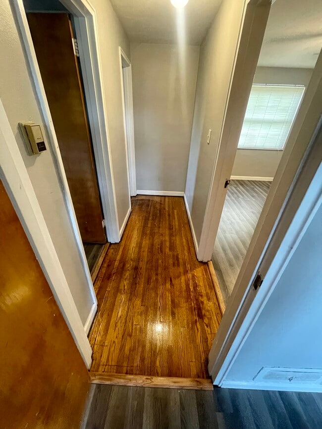 Hallway to kitchen (left), bedroom (right) and bathroom (back left) - 1083 Sells Ave