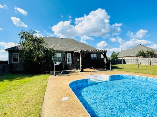 Building Photo - Enjoy summer days with a pool