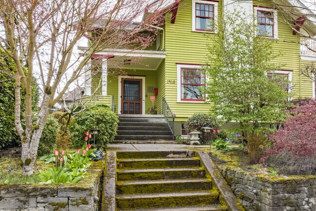 Moss-covered steps complement this green-toned Arts and Crafts home in Irvington.