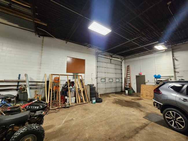14' overhead door and service door - 210 W Cecil St