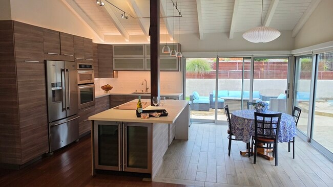 Kitchen opens to dining area and living room. - 3078 Saddleback Ct