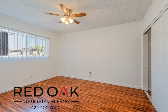 Building Photo - Serene Two Bedroom with Stylish Floors, In...