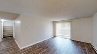Located at 7645 SW Bonita Rd in Tigard, Oregon, this three-bedroom, one-bathroom single-floor unit offers a practical and comfortable layout. The living room features durable wood-style flooring, a textured ceiling, and a sliding glass door with vertical blinds that opens to a private balcony, allowing natural light to fill the space. Baseboard heating is present throughout, ensuring year-round comfort.

The kitchen is well-equipped with warm-toned wood cabinetry, light countertops, a white electric range, dishwasher, and refrigerator, complemented by a pantry for additional storage. An adjacent dining area provides a seamless flow between cooking and dining spaces.

Each of the three bedrooms is carpeted for comfort and includes closet storage. The bedrooms feature textured ceilings and windows that bring in natural light with views of the surrounding greenery. Baseboard heaters are present in the bedrooms as well.

The bathroom is cleanly appointed with a wood-toned vanity, light countertop, a tub-shower combination with a curved rod, and wood-style flooring that ties the space together with the rest of the unit. The overall design is neutral and functional, making it an informative and easy-to-assess space.