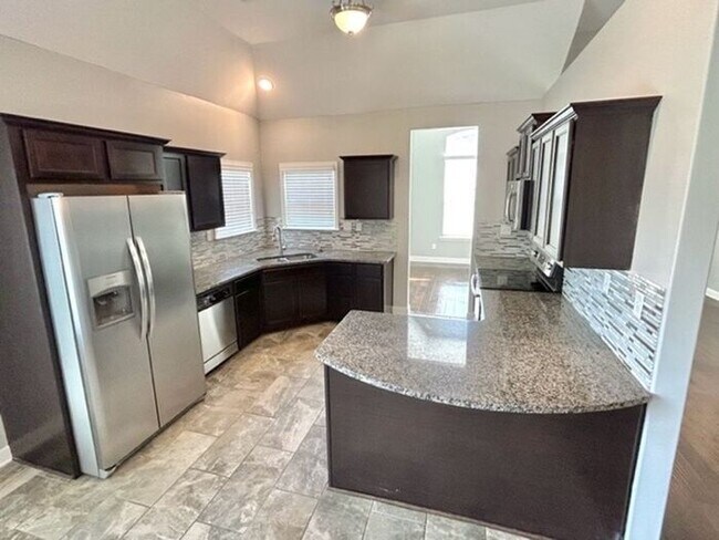 Building Photo - Available Now! Now Leasing a Spacious 4- B...