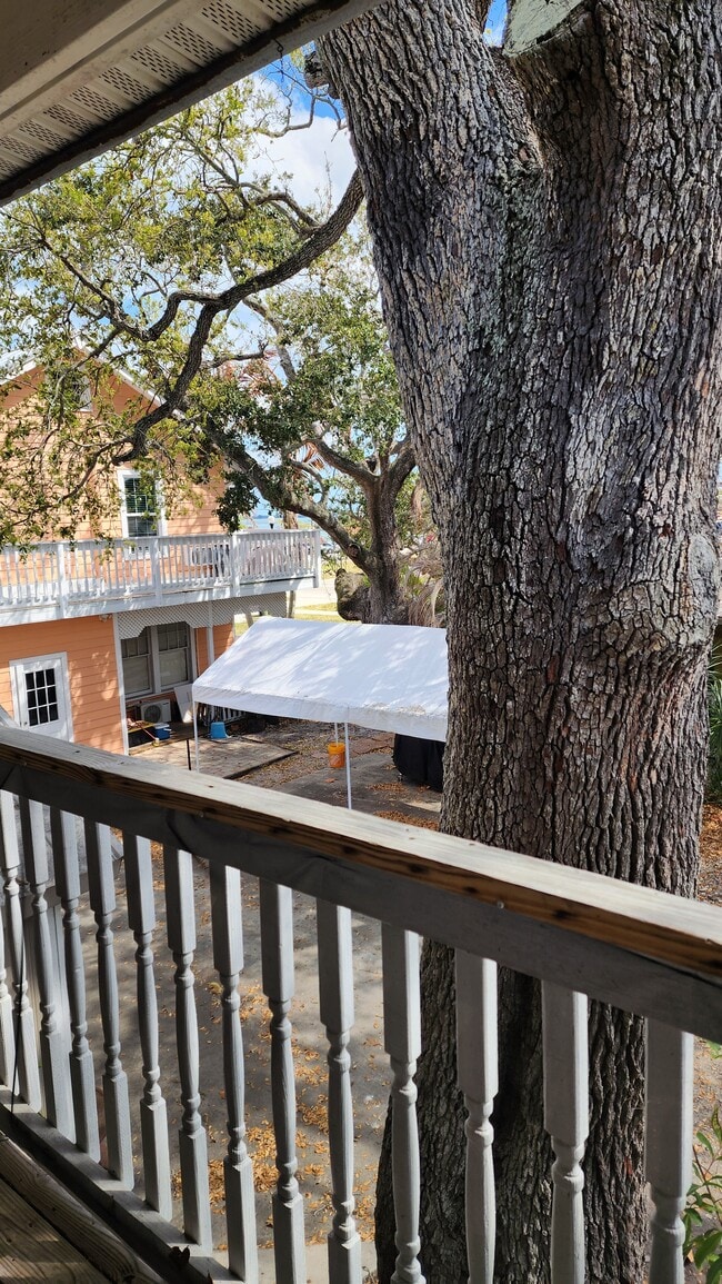 Balcony under the oaks. - 803 Indian River Dr