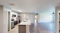 Step into a world of possibilities in this exquisitely crafted 3-bedroom, 2-bathroom home. With 1,210 square feet of thoughtfully designed living space, this single-story haven offers the perfect blend of comfort and contemporary style.

The heart of this home is the stunning open-concept kitchen and living area. Sleek white cabinetry, stainless steel appliances, and a stylish subway tile backsplash create a culinary space that's both functional and aesthetically pleasing. The adjoining living room, bathed in natural light from large windows, provides an ideal setting for relaxation and entertainment.

Each bedroom is a private retreat, with the primary suite boasting a generous 160 square feet of space. Plush carpeting, ceiling fans, and ample closet space ensure comfort and convenience in every room. The bathrooms feature modern fixtures, expansive vanities, and a clean, crisp design that exudes luxury.

Throughout the home, warm wood-look flooring creates a seamless flow, while neutral tones provide a blank canvas for your personal style. Energy-efficient lighting and appliances not only reduce your carbon footprint but also your utility bills.

This home isn't just a place to live; it's a lifestyle upgrade. Imagine lazy Sunday mornings in your sun-drenched living room, or hosting dinner parties in your gleaming kitchen. With its perfect balance of style and functionality, this property offers the opportunity to turn your homeownership dreams into reality. Welcome home to MacAlpine Place - where your best life begins.