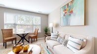 Located in Hilliard, Ohio, this thoughtfully designed single-floor residence offers 1 bedroom and 2 full bathrooms across a comfortable and efficiently laid-out floor plan. The open-concept living and dining area is bright and welcoming, featuring light hardwood-style flooring, neutral walls, and large windows with slatted blinds that invite generous natural light and leafy outdoor views. The kitchen is well-equipped with white cabinetry, marble-style countertops, and stainless steel appliances including a range, microwave, and dishwasher. The spacious primary bedroom features plush carpeting, a large window overlooking greenery, and access to two walk-in closets outfitted with wire shelving systems for ample storage. A second living room provides additional flexible space with carpeted flooring and large windows, ideal as a sitting room or media lounge. Both bathrooms are finished with white vanity cabinetry, marble-style countertops, chrome fixtures, and tile flooring. The overall ambiance is clean, neutral, and move-in ready, with a cohesive design aesthetic throughout that balances comfort and functionality.