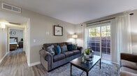 Located in Highland, California, this single-floor residence offers a thoughtfully designed layout with comfortable living spaces throughout. The living room serves as the heart of the home, featuring wood-look flooring, a sliding glass door that fills the room with natural light and provides access to an outdoor area, and a mini-split system for year-round comfort. The adjacent dining area is highlighted by a ceiling fan overhead and wood-look flooring that flows seamlessly from the living space, creating an open and connected feel. The kitchen is well-equipped with white cabinetry, granite-style countertops, stainless steel appliances including a gas range, dishwasher, and refrigerator, as well as a skylight that brings in additional natural light. The bedrooms offer comfortable retreats, including a spacious primary bedroom with a large window and built-in closet, and a secondary bedroom with charming string lighting and a natural light-filled window. Both bathrooms feature white cabinetry with granite countertops and wood-look tile flooring, with the primary bath offering a vanity area and shower. Throughout the home, consistent wood-look flooring, neutral tones, and clean finishes contribute to a cohesive and inviting atmosphere.