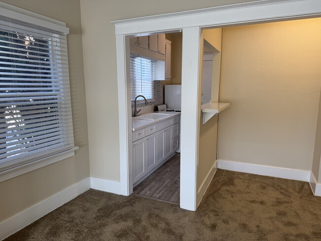 Kitchen and nook as viewed from the living room. - 1749 E 3rd St