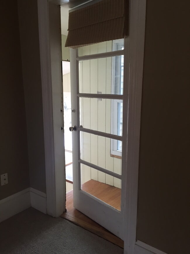 Door off of living room that leads to sunny 3 season room - 171 W Emerson St