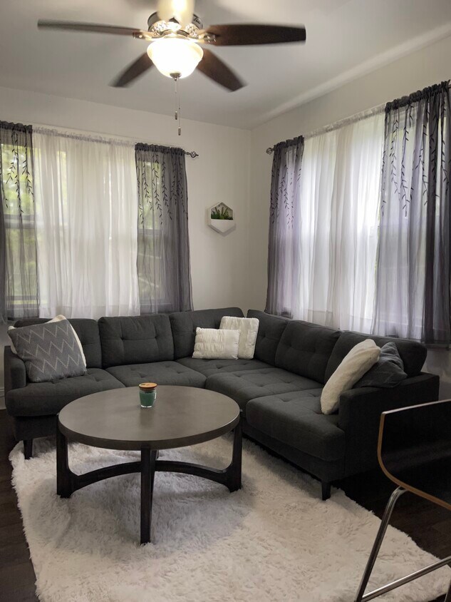 Living room, 4 large windows that overlook Sumner Brook, an expansive, beautiful tree-filled area. - 43 Front St