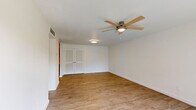 Located at 2901 Beachwood Blvd in Jacksonville, FL, this single-story, three-bedroom, one-bathroom home offers a practical and comfortable layout across a well-proportioned floor plan. Light-toned wood-look flooring runs consistently throughout, lending a clean, cohesive feel to the interior.

The living room is a bright, open space featuring a textured ceiling, a ceiling fan with light fixture, and a large sliding glass door that fills the room with natural light and provides direct views of the surrounding greenery. A bold green entry door adds a distinctive touch to the space.

The kitchen is well-appointed with rich, dark wood cabinetry, white countertops, a double-basin sink, and a full suite of stainless steel appliances including a dishwasher, electric range, and over-the-range microwave.

Each of the three bedrooms is finished with wood-look flooring and ceiling fans, and features built-in closet systems with shelving and hanging rods. The generously sized primary bedroom benefits from natural light through a window with outdoor views. The additional bedrooms offer comparable finishes and functionality.

The bathroom is clean and well-maintained, featuring a full tub-shower combination with built-in shelving, a vanity with a white countertop, and tile flooring. A hallway connects the rooms, contributing to an efficient and straightforward floor plan throughout.