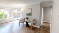 Step into a world of refined elegance and contemporary charm. This exquisite 1-bedroom, 2-bathroom apartment is a testament to smart design and luxurious living. The moment you enter, you'll be captivated by the seamless flow of the open-concept layout, adorned with sleek wood-look flooring that stretches throughout the 590 square feet of living space.

The living area is a blank canvas for your imagination, boasting ample natural light that pours in through large windows, creating an airy and inviting atmosphere. Picture yourself unwinding here after a long day, surrounded by your curated decor and cherished art pieces.

The kitchen is a culinary enthusiast's dream, featuring pristine white cabinetry, modern appliances, and a cleverly designed layout that maximizes both storage and functionality. Prepare gourmet meals or quick bites with equal ease in this stylish and efficient space.

The generously sized 140 square foot bedroom offers a tranquil retreat, with neutral tones that promote relaxation and windows that frame picturesque views. Two impeccably designed bathrooms elevate daily routines to spa-like experiences, complete with elegant fixtures and finishes.

Throughout the home, thoughtful touches like crown molding and updated lighting fixtures add a layer of sophistication. The property's location at 655 N Brea Blvd puts you at the heart of Brea's vibrant community, with easy access to shopping, dining, and entertainment.

This is more than just a home; it's a lifestyle upgrade that promises comfort, style, and the perfect backdrop for creating lasting memories. Don't miss this opportunity to elevate your living experience in one of Brea's most desirable addresses.
