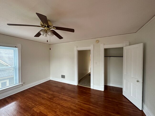 living room with hardwood floors and storage closet - 604 W Union St
