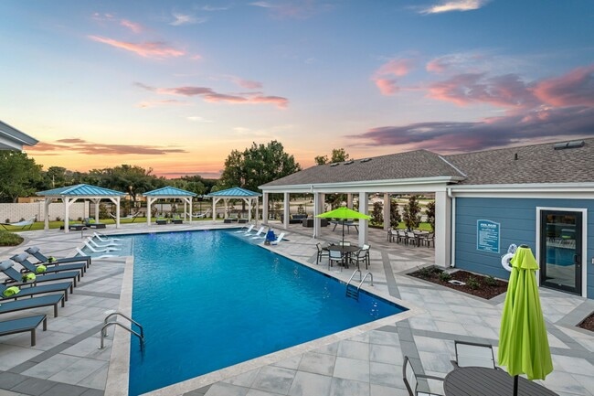 Resort-Inspired Swimming Pool with Covered Pavilion & Reservable Cabanas - Alluvia Apartments