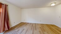 Located at 704 E Lincoln Trail Blvd in Radcliff, Kentucky, this two-bedroom, two-bathroom unit is thoughtfully laid out across two floors, each offering an equal share of living space. The main level features a welcoming entrance that flows into a combined living and dining area, where light wood-style flooring, neutral cream walls, and a textured ceiling create a clean, inviting atmosphere. A sliding glass door brings in natural light and provides outdoor access. The kitchen is equipped with warm wood cabinetry, a double sink, white appliances including a refrigerator, electric range, and dishwasher, and is finished with tile flooring and a window above the sink. A dedicated laundry area with washer hookups adds practical convenience. The upper floor hosts both bedrooms, each featuring light hardwood-style flooring, neutral walls, and natural light from windows with blinds. The spacious primary bedroom offers generous room to furnish comfortably. The second bedroom includes a closet with louvered doors. Five closets are distributed throughout the unit, ensuring ample storage. Both bathrooms feature tile flooring and warm wood vanities; one includes a tiled shower-tub combo. Textured ceilings are consistent throughout, adding a classic residential character to the home.