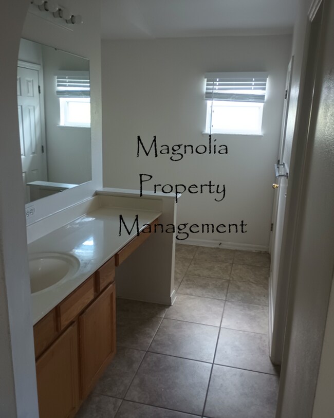 Building Photo - New Paint, Floors and Solid Surface Counte...