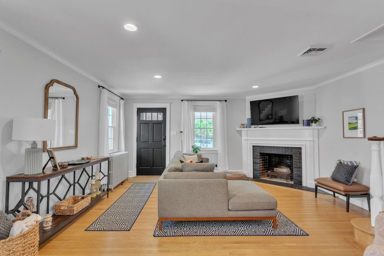 Living room entrance with comfy couch and seating. Roku TV equipped. - 2314 Bryn Mawr Ave