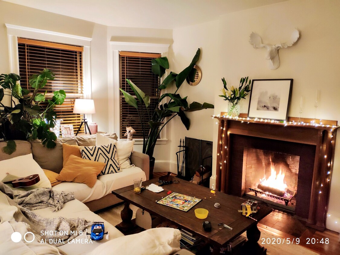 Living room with bay windows and fireplace - 74 Highland Ave