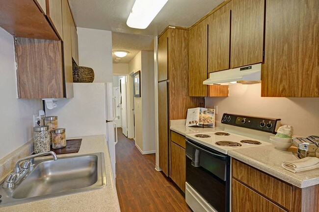 Upgraded cabinets and counter tops - Baycliff Apartments